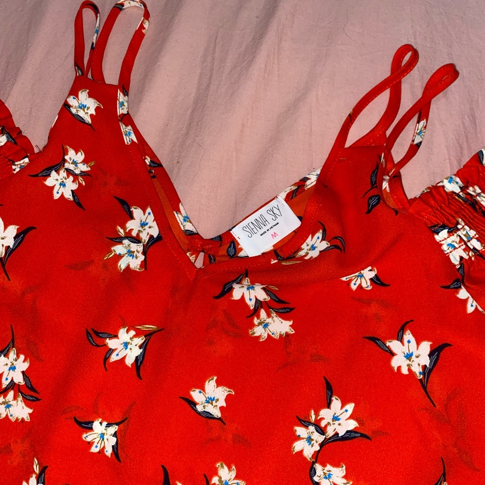 red women's blouse with white flowers